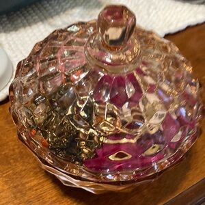 Over twenty pieces of jewelry mystery pink glass container.